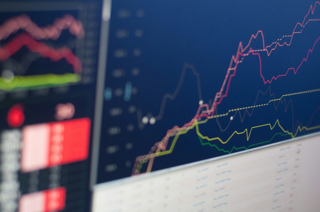 Screen displaying colored line charts and numerical tables for web analytics